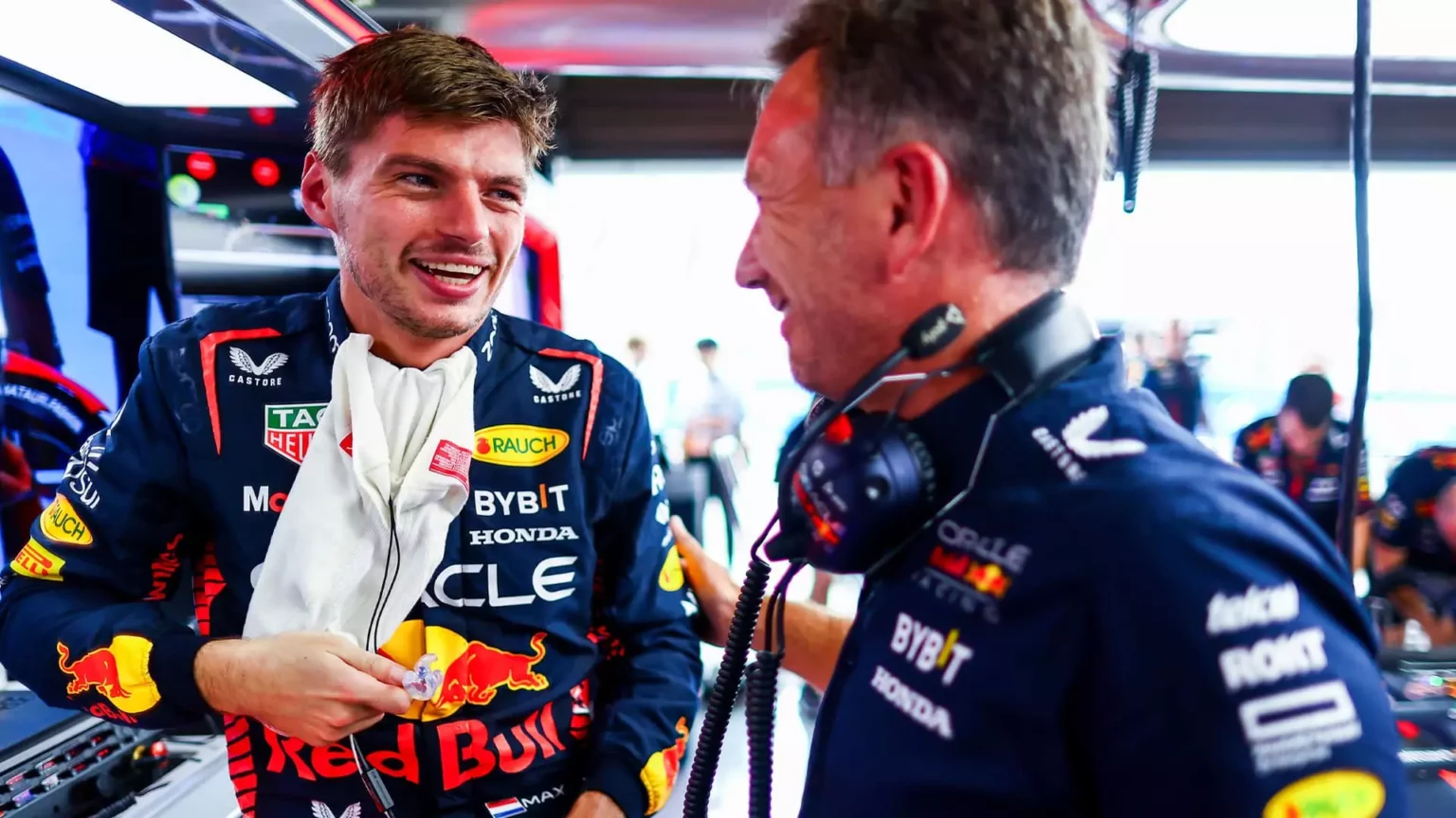 Max Verstappen talks to Christian Horner in the garage