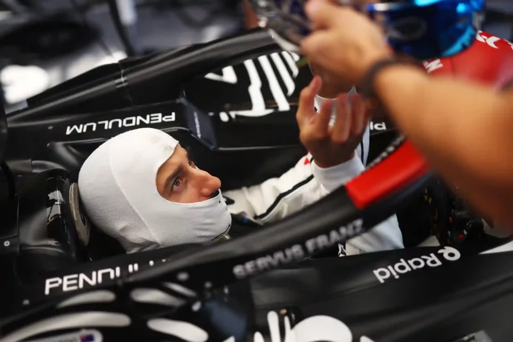 Daniel Ricciardo of Australia and Scuderia AlphaTauri prepares to drive in the garage during Formula 1 testing at Yas Marina Circuit on November 28, 2023 in Abu Dhabi, United Arab Emirates